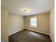 Cozy bedroom featuring neutral paint and carpet flooring, with natural light from the window at 246 Bridgewood Se Dr, Conyers, GA 30094