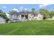 Charming home featuring a well-manicured lawn, classic neutral paint, and a welcoming front entrance at 246 Bridgewood Se Dr, Conyers, GA 30094