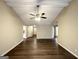 Open floor plan features wood floors, ceiling fan and neutral paint at 246 Bridgewood Se Dr, Conyers, GA 30094