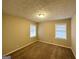 Neutral bedroom featuring carpeted floors, a bright window, and great natural light at 2922 Dale Pl, Decatur, GA 30032