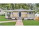 Charming home featuring a well-maintained front yard, stone walkway and inviting front porch at 2922 Dale Pl, Decatur, GA 30032