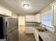 Efficient kitchen with granite countertops, stainless steel refrigerator and ample storage space at 2922 Dale Pl, Decatur, GA 30032