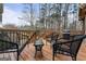 Spacious wooden deck featuring outdoor seating and a grill, perfect for entertaining at 4186 Highway 138 Sw, Stockbridge, GA 30281