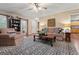 Comfortable living room with hardwood floors, and a view into an adjacent kitchen at 4186 Highway 138 Sw, Stockbridge, GA 30281