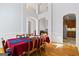 Elegant dining room featuring high ceilings, arched doorways, and hardwood floors at 135 Antoinette Ave, Mcdonough, GA 30252