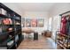 Bright living room featuring hardwood floors, built-in shelving, and a work space at 71 Intown Pl, Fayetteville, GA 30214