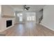 Spacious living room with brick fireplace, hardwood floors, and open floor plan at 4368 Burton Bend Way, Buford, GA 30518