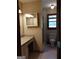 Full bathroom with vanity and cabinet with view of shower stall and toilet at 9000 Edinburg Dr, Winston, GA 30187