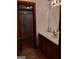 Bathroom with single vanity, tub, and neutral finishes at 9000 Edinburg Dr, Winston, GA 30187
