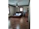 Bedroom with wood-look flooring, ceiling fan and natural light at 9000 Edinburg Dr, Winston, GA 30187