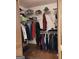 Walk-in closet with clothes racks, wire shelving, and a variety of personal items at 9000 Edinburg Dr, Winston, GA 30187