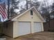 Spacious two-car garage with neutral siding complements the property's exterior at 9000 Edinburg Dr, Winston, GA 30187