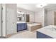 Primary bathroom with a soaking tub, double sinks, and a separate shower at 44 Star Spangled Ln, Peachtree City, GA 30269