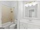 Bright bathroom featuring a shower-tub combo, modern fixtures, and a large vanity with storage at 44 Star Spangled Ln, Peachtree City, GA 30269