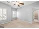 Cozy bedroom with carpeted floors, natural light, and neutral paint, perfect for relaxation at 44 Star Spangled Ln, Peachtree City, GA 30269