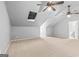 Spacious bonus room with multiple ceiling fans, skylight and adjoining bathroom at 44 Star Spangled Ln, Peachtree City, GA 30269