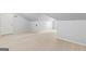 Finished bonus room with neutral carpet, featuring sloped ceilings and good ceiling height for additional living space at 44 Star Spangled Ln, Peachtree City, GA 30269