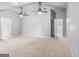 Expansive bonus room featuring two ceiling fans and multiple doorways for flexible living space at 44 Star Spangled Ln, Peachtree City, GA 30269