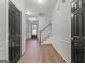 Open foyer with hardwood floors, white wainscoting and a staircase leading to the upper level of the home at 44 Star Spangled Ln, Peachtree City, GA 30269