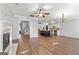 Spacious and open-concept living area leading to a modern kitchen and staircase, great for entertaining guests at 44 Star Spangled Ln, Peachtree City, GA 30269