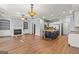 Spacious living room featuring a fireplace with built-ins and an open layout to the kitchen with a center island at 44 Star Spangled Ln, Peachtree City, GA 30269