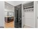 Mud room with a black door, a built-in closet, and easy access to the kitchen at 44 Star Spangled Ln, Peachtree City, GA 30269