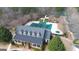 Aerial view of the community pool and recreational area including waterslide and covered clubhouse at 44 Star Spangled Ln, Peachtree City, GA 30269