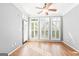 Sun-lit room with hardwood floors and many windows that let in natural light at 44 Star Spangled Ln, Peachtree City, GA 30269