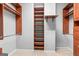 Walk-in closet with wood shelving and ample storage space at 44 Star Spangled Ln, Peachtree City, GA 30269