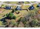 Aerial view of a landscaped back yard on a wooded lot at 1022 Gloria Grand Blvd, Mcdonough, GA 30252