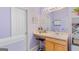 Vanity area with sink, stool, mirror and cabinetry at 1022 Gloria Grand Blvd, Mcdonough, GA 30252