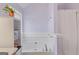 Bright bathroom showcases a large tub and natural light from an adjacent window at 1022 Gloria Grand Blvd, Mcdonough, GA 30252