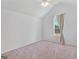 A simple room with carpet and a window with curtains at 1022 Gloria Grand Blvd, Mcdonough, GA 30252