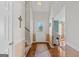 Welcoming foyer with hardwood floors, decorative lighting, and high ceilings at 1022 Gloria Grand Blvd, Mcdonough, GA 30252