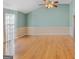 Bright living room with hardwood floors, high ceilings, and neutral wall paint at 1022 Gloria Grand Blvd, Mcdonough, GA 30252