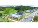 Aerial view of the community pool, playground, landscaping, and nearby homes in a well-planned neighborhood at 1724 Goodwin Dr # 74, Hampton, GA 30228