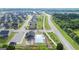 Aerial view of a new housing development with a community pool, playground, and splash pad at 1724 Goodwin Dr # 74, Hampton, GA 30228