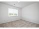 Neutral bedroom featuring neutral carpet and a window with blinds at 1724 Goodwin Dr # 74, Hampton, GA 30228