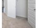 Bedroom featuring neutral carpet and an open closet with shelving at 1724 Goodwin Dr # 74, Hampton, GA 30228