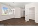 Bright dining room features hardwood floors, a window with blinds, and modern lighting at 1724 Goodwin Dr # 74, Hampton, GA 30228