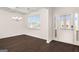 Bright dining room featuring hardwood floors, a modern chandelier, and ample natural light at 1724 Goodwin Dr # 74, Hampton, GA 30228