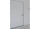 Image of a standard six panel door with white paint and silver hardware at 1724 Goodwin Dr # 74, Hampton, GA 30228