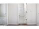 Hallway with white trim and doors leading to the bathroom and bedroom at 1724 Goodwin Dr # 74, Hampton, GA 30228