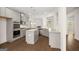 Modern kitchen with stainless steel appliances, granite countertops, kitchen island and hardwood floors at 1724 Goodwin Dr # 74, Hampton, GA 30228