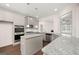 Modern kitchen featuring stainless steel appliances, granite countertops, kitchen island and hardwood floors at 1724 Goodwin Dr # 74, Hampton, GA 30228