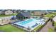 Community pool with a playground and lounge chairs, perfect for summer relaxation at 1724 Goodwin Dr # 74, Hampton, GA 30228