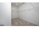 Spacious walk-in closet with carpeted flooring and ample shelving for organized storage at 1724 Goodwin Dr # 74, Hampton, GA 30228