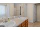 Bathroom featuring double sinks, a large mirror, and neutral finishes at 141 Whistle Way, Locust Grove, GA 30248