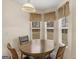 Charming breakfast nook with round table, ideal for morning coffee and casual meals at 141 Whistle Way, Locust Grove, GA 30248