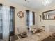 Elegant dining room with stylish decor, including a modern chandelier and ornate wall accents at 141 Whistle Way, Locust Grove, GA 30248
